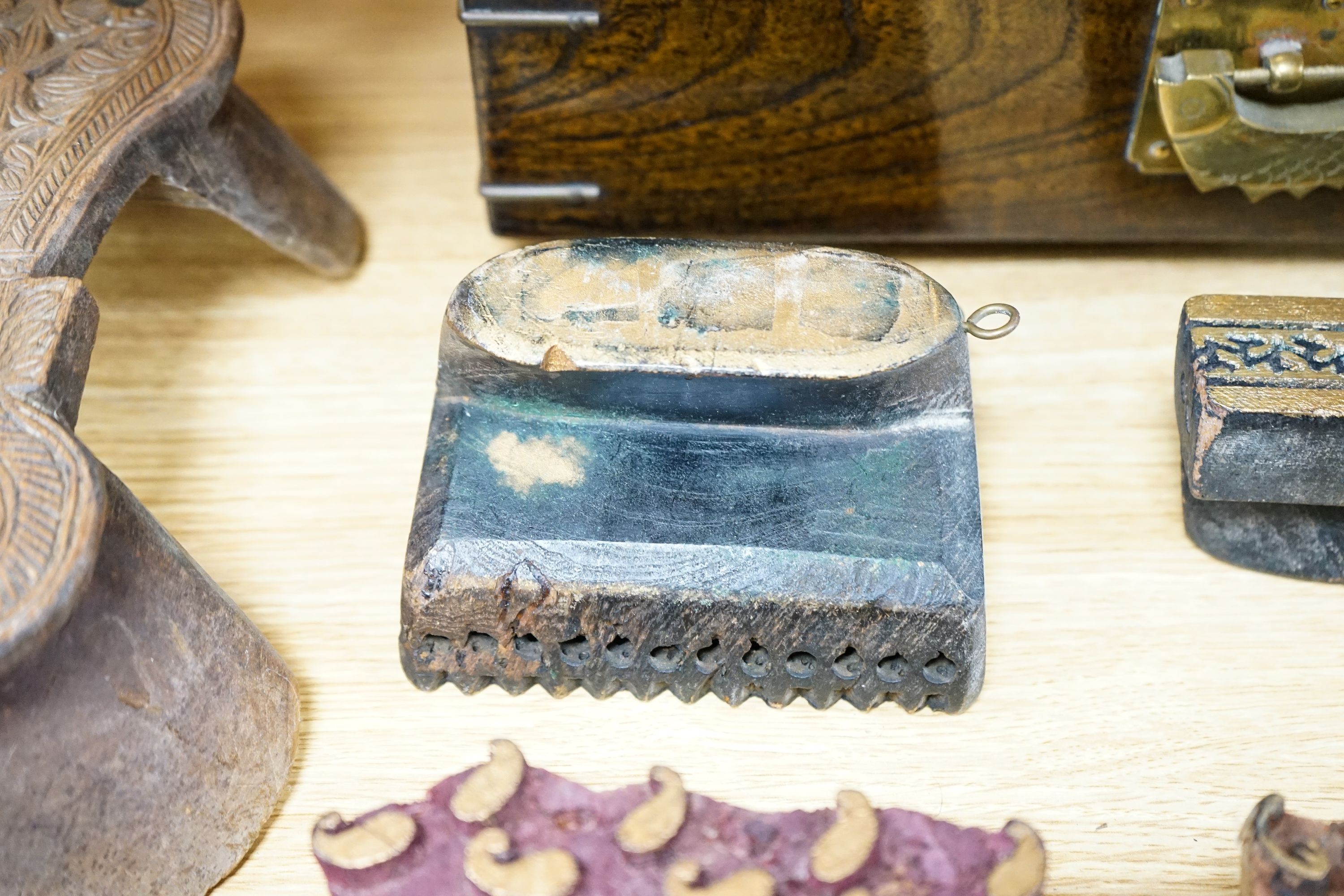 A mixed group of Indian fabric printing blocks and a Chinese wood box, 40.5cm